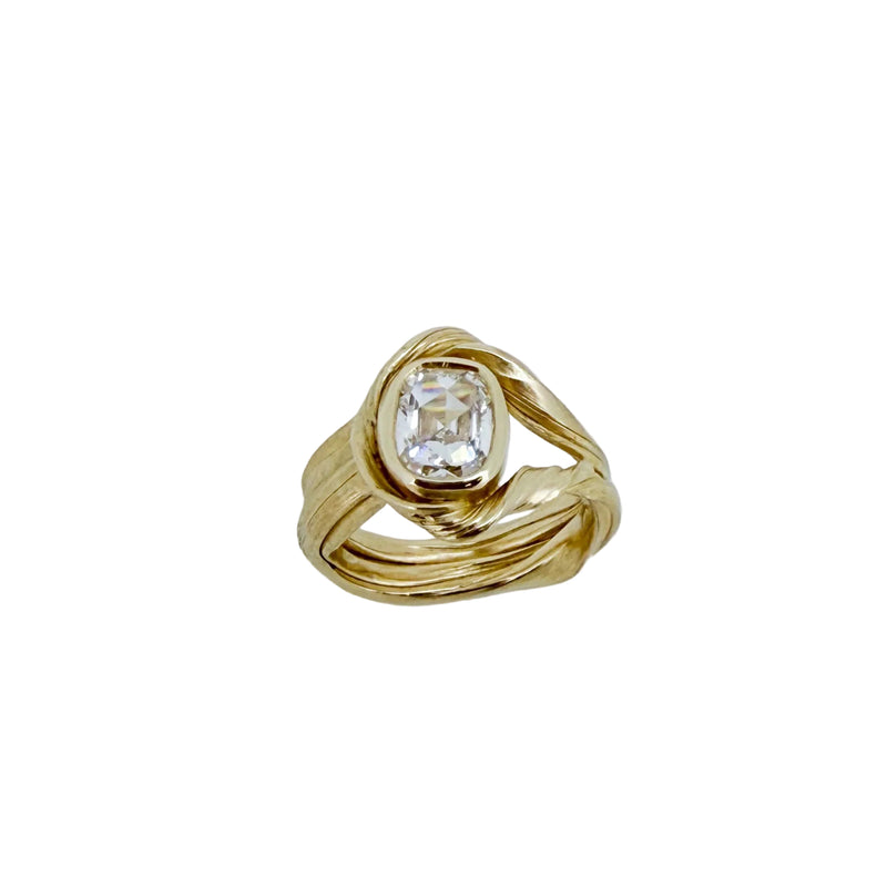Gold ring with a diamond on a white background