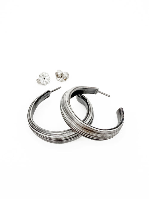 sterling silver mitsuro hikime hoop earrings by Michelle Hoting that resemble canyon strata.