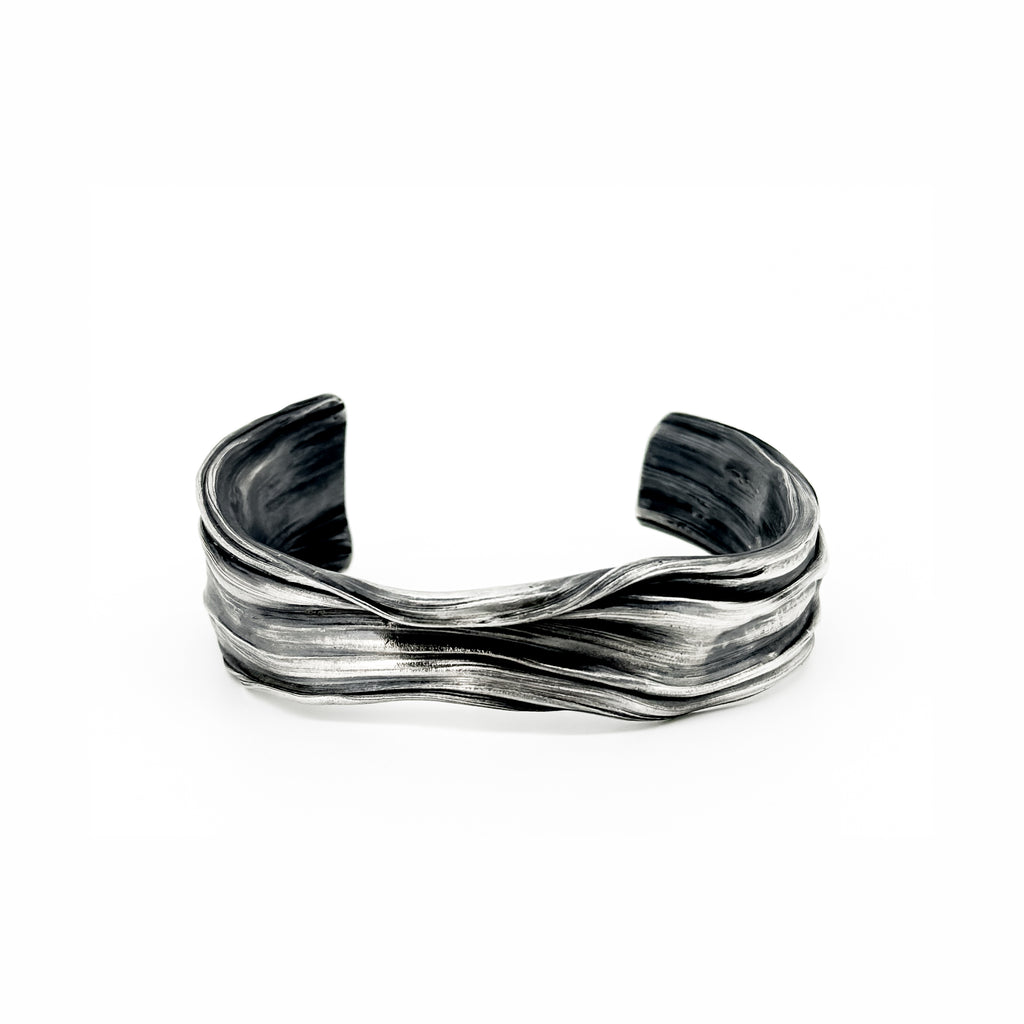The Meander Cuff Bracelet in sterling silver by jewelry artist Michelle Hoting created using the mituro hikime art form