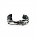 The Meander Cuff Bracelet in sterling silver by jewelry artist Michelle Hoting created using the mituro hikime art form