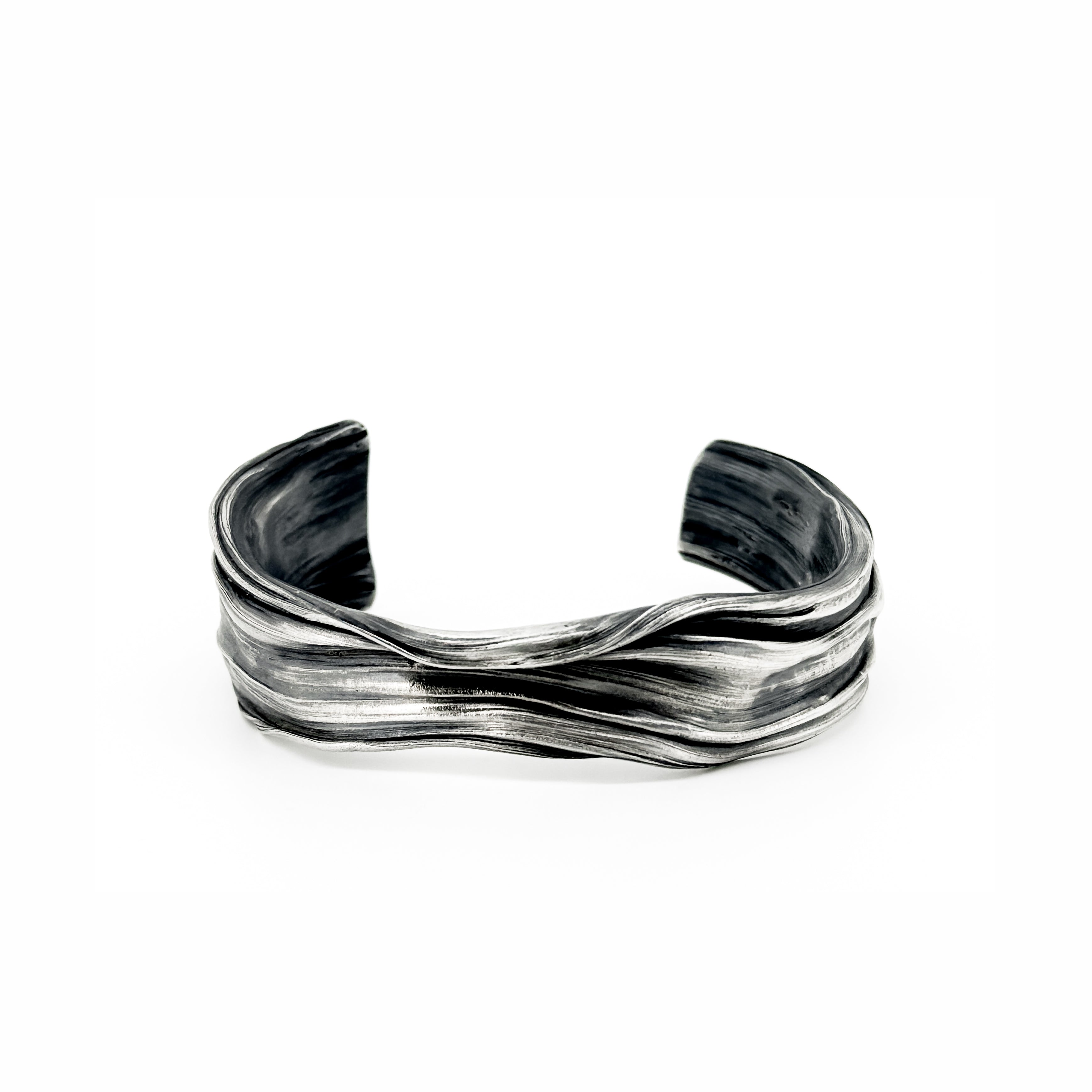 The Meander Cuff Bracelet in sterling silver by jewelry artist Michelle Hoting created using the mituro hikime art form
