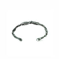 a cuff bracelet created to resemble pahoehoe lava by michelle hoting, using mitsuro hikime wax