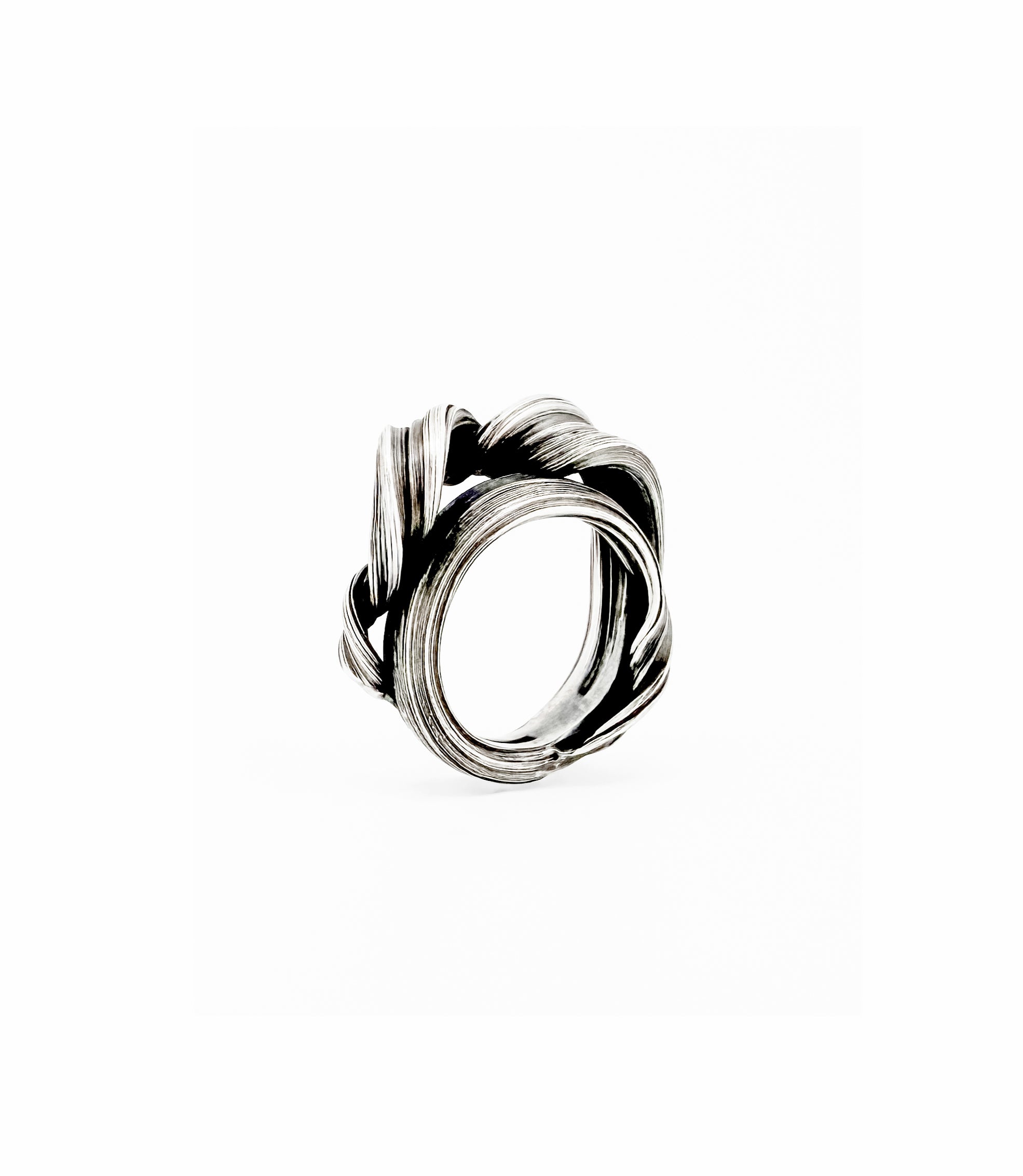 a sterling silver ring created to resemble undulating curling wave by jewelry artist Michelle Hoting using the Mitsuro Hikime technique
