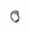 a sterling silver and akoya pearl ring created to resemble sea foam at the edge of a crashing wave by jewelry artist Michelle Hoting using the Mitsuro Hikime technique