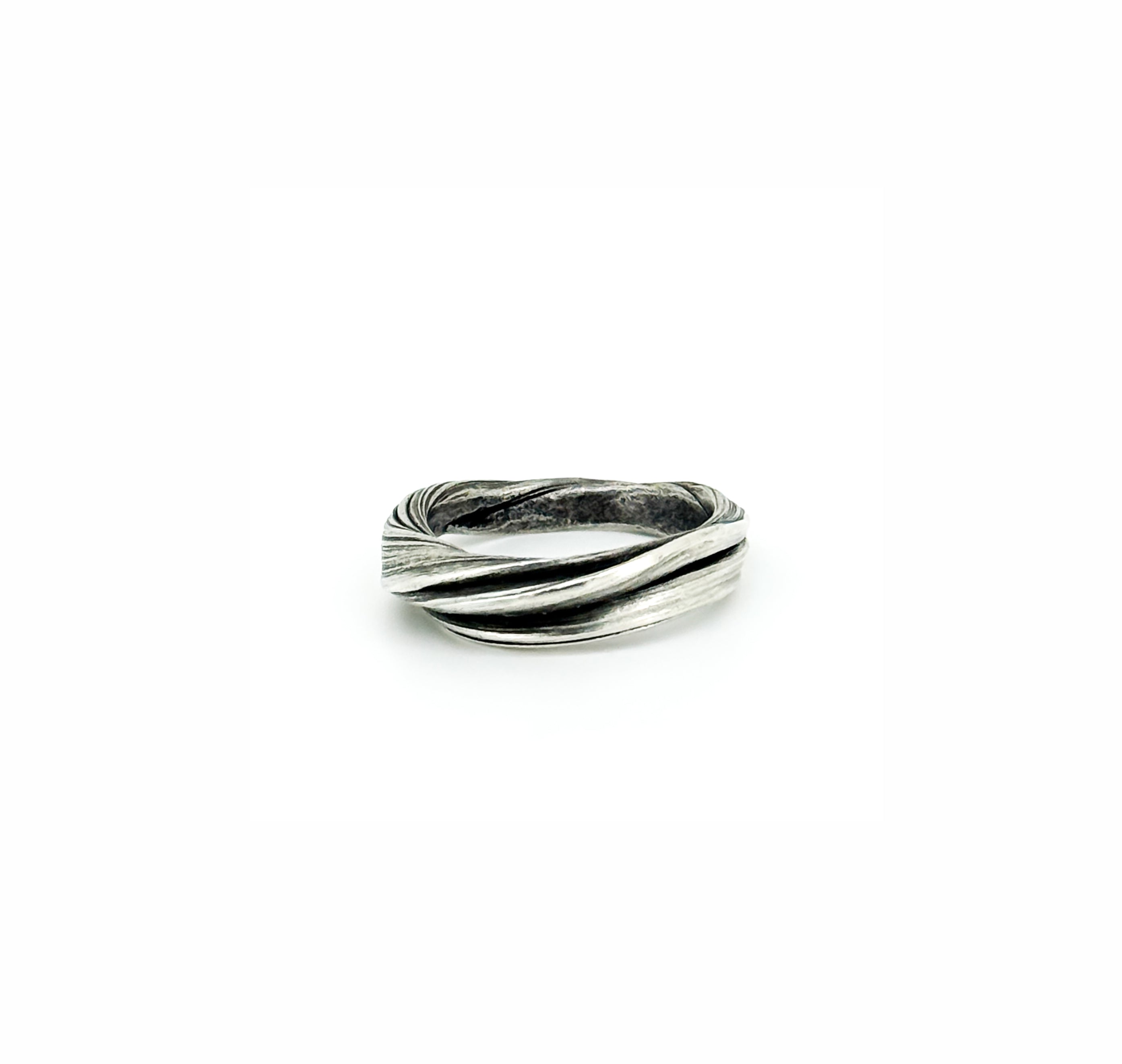 sterling silver band style ring with a flowing strata like twist design by Michelle Hoting in mitsuro hikime
