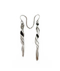 a pair of sterling silver earrings with a sculptural wave like twisting pattern hand fabricated by jewelry artist Michelle Hoting using the Mitsuro Hikime technique