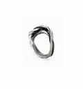 a silver ring with a sculptural wave like twisting pattern hand fabricated by jewelry artist michelle hoting