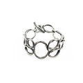 a sterling silver bracelet created to resemble beach pebbles by jewelry artist Michelle Hoting using the Mitsuro Hikime technique
