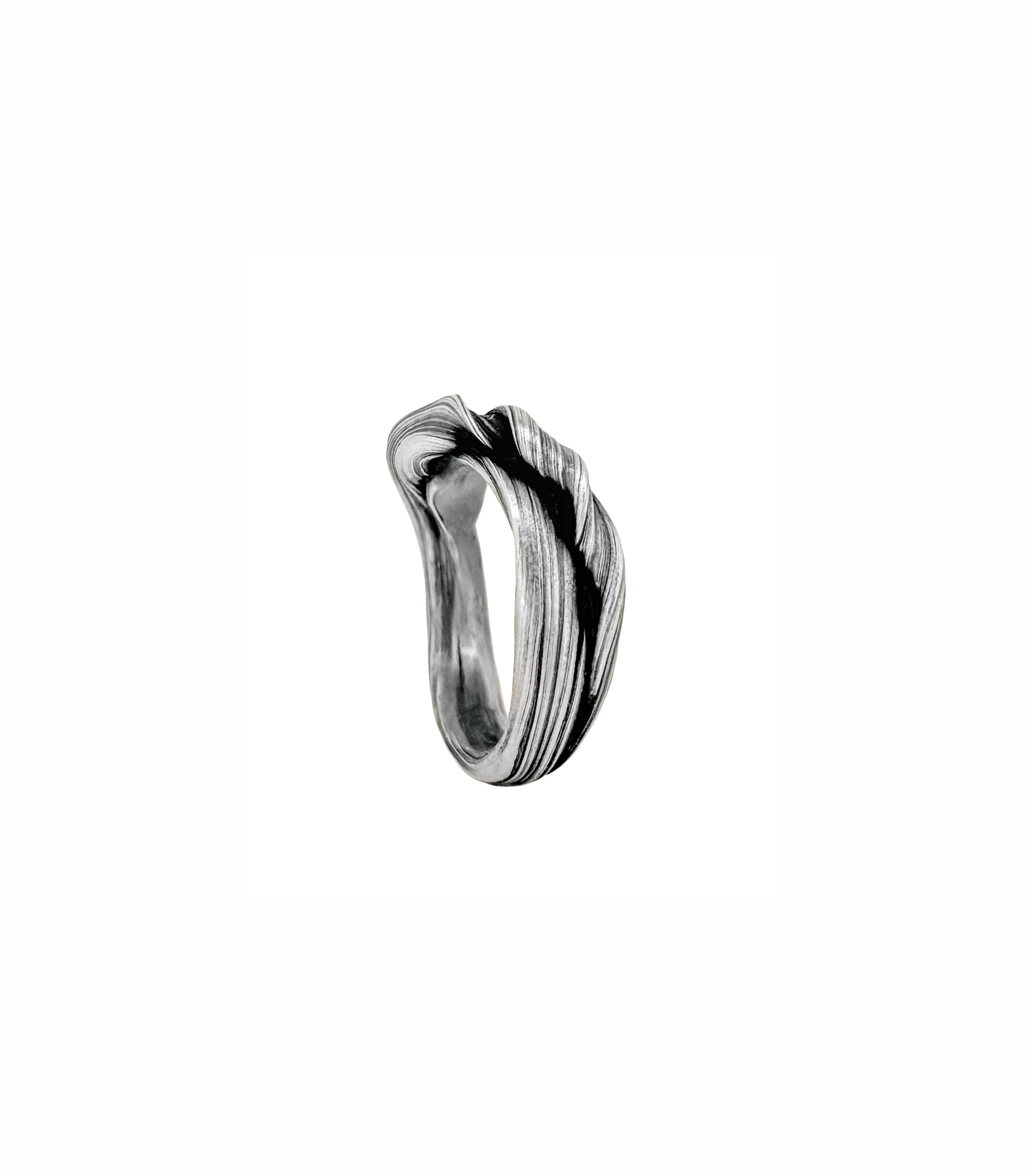 silver mitsuro hikime sculptural style ring by Michelle Hoting that resembles undulating canyon strata at antelope canyon